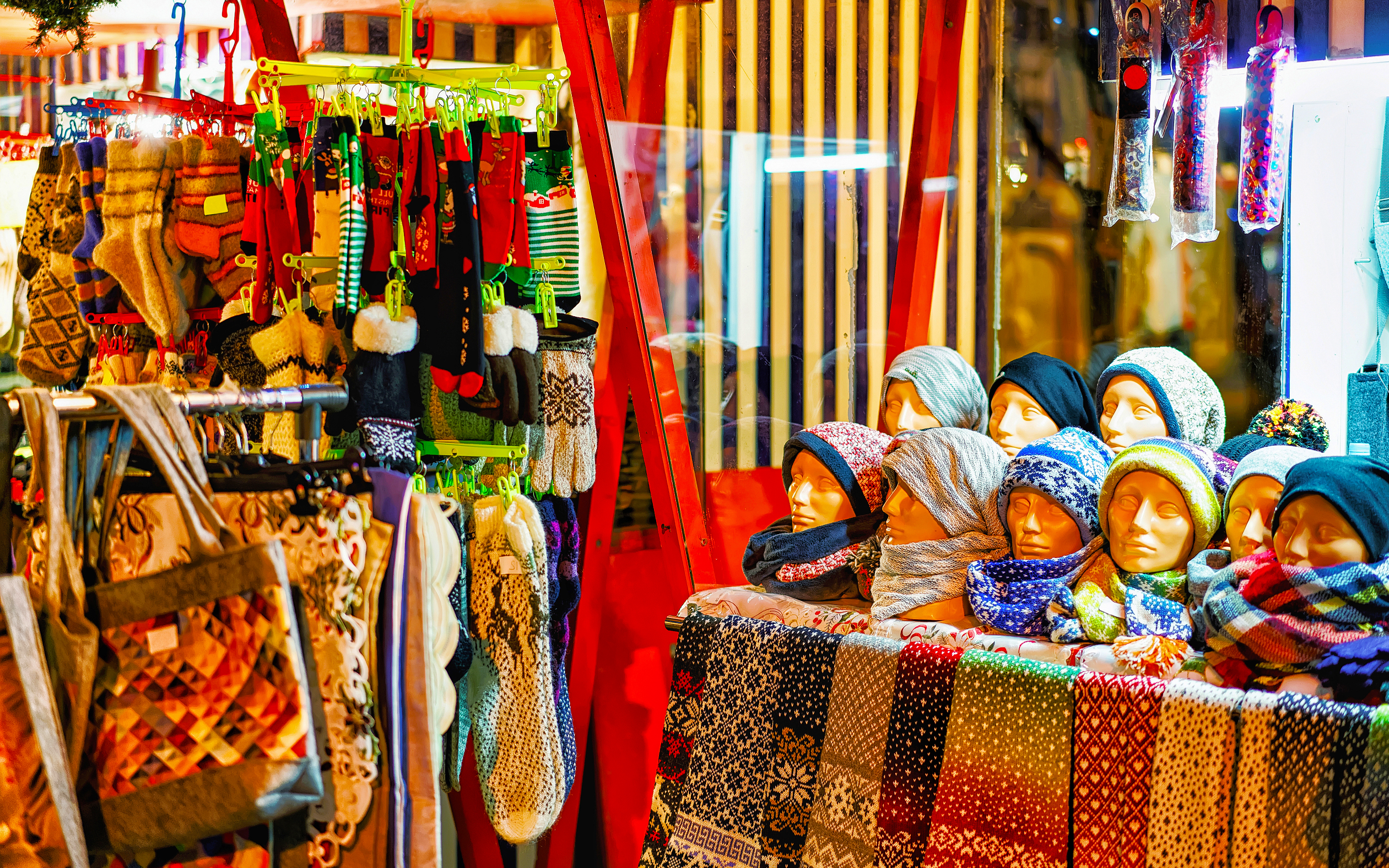 knitted goods displayed christmas market stall old town riga latvia wool mittens gloves socks with hats winter street xmas holiday fair european city advent crafts bazaar