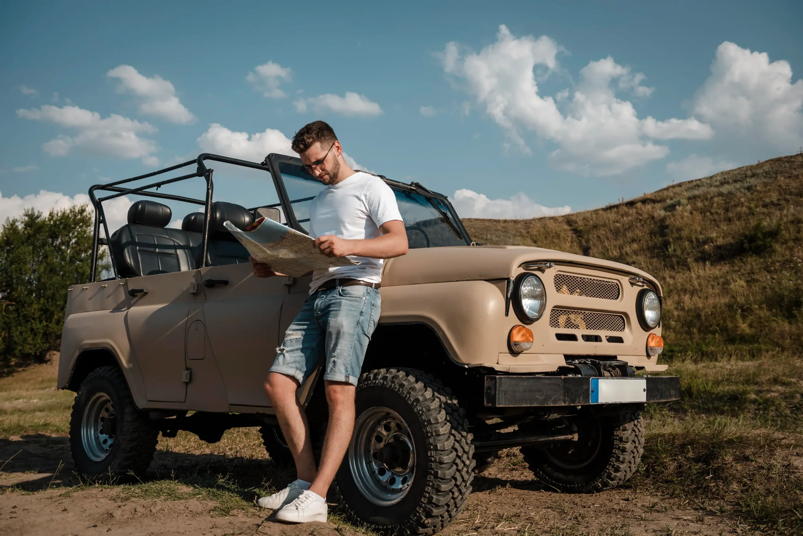 man traveling by car looking map scaled