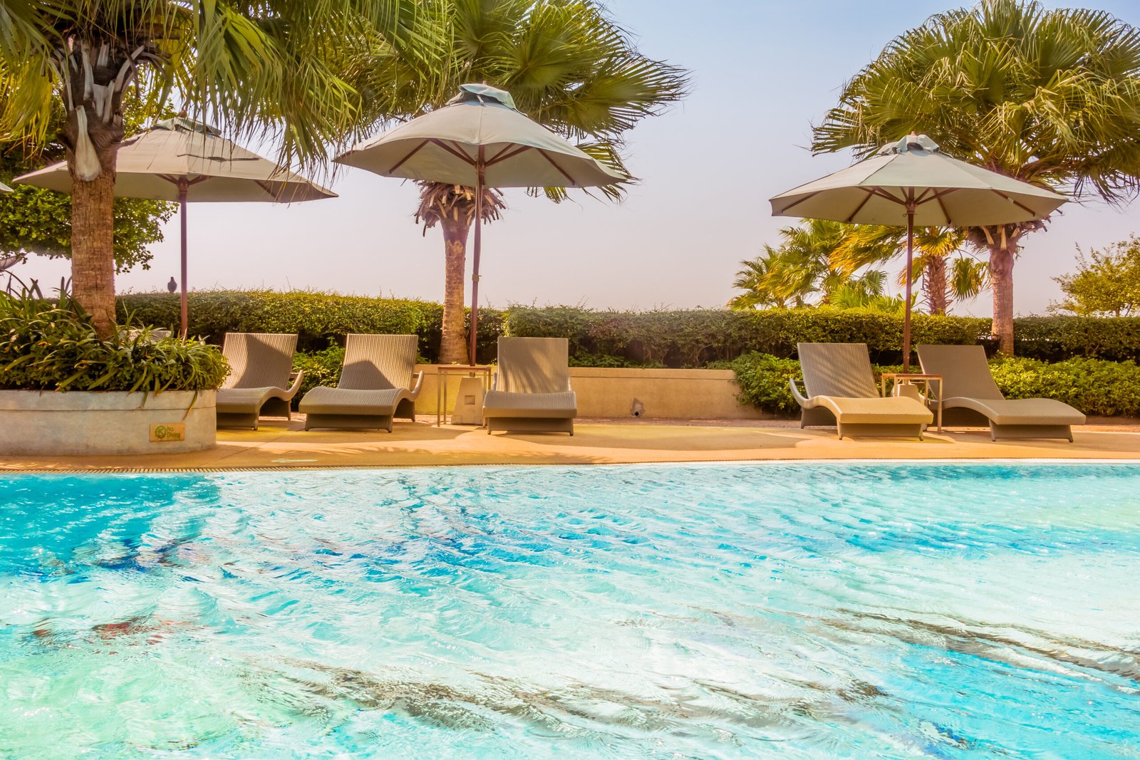 O'Atlas 1 Umbrella and chair around beautiful luxury swimming pool in hotel resort - Vintage and boost up color Processing